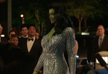 Actor Tatiana Maslany portrays Jennifer Walter/She-Hulk with CGI green skin and hair. She is walking while wearing a silver beaded ballgown.