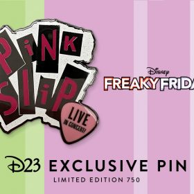 Artwork for D23 Exclusive Freaky Friday Pin on a colorful background, bearing artwork that looks like the punk rock logo of the fictional band Pink Slip including a guitar pick reading “Live in Concert.” The pin is featured on a pink and green backer card reminiscent of the iconic film poster and the contrasting worlds of mother and daughter Tess and Anna Coleman.